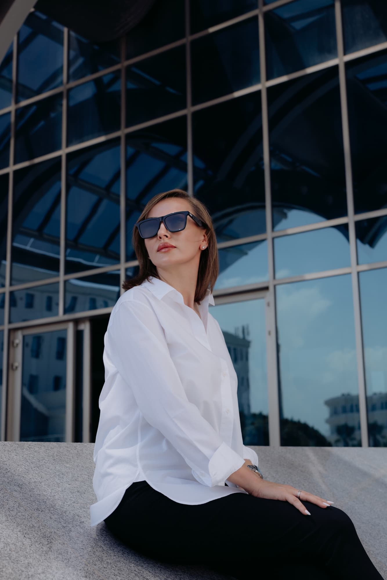 Alina Berez outside a contemporary building